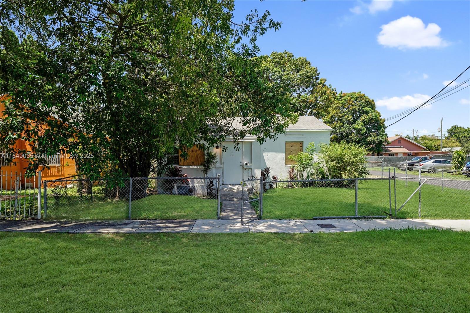 2-bedroom, 1-bath home offering 1,076 sq ft of living space on a corner lot in the vibrant city of Miami. Enjoy a spacious fenced front and back yard, perfect for outdoor living. Featuring a simple, original layout, this 1940s home retains its timeless character and offers plenty of potential. Blocks away from Charles Hadley Park and just minutes from major highways—placing you a short drive from Miami Airport, the Health District, Wynwood, Downtown Miami, and Brickell. A great investment opportunity in a prime location.