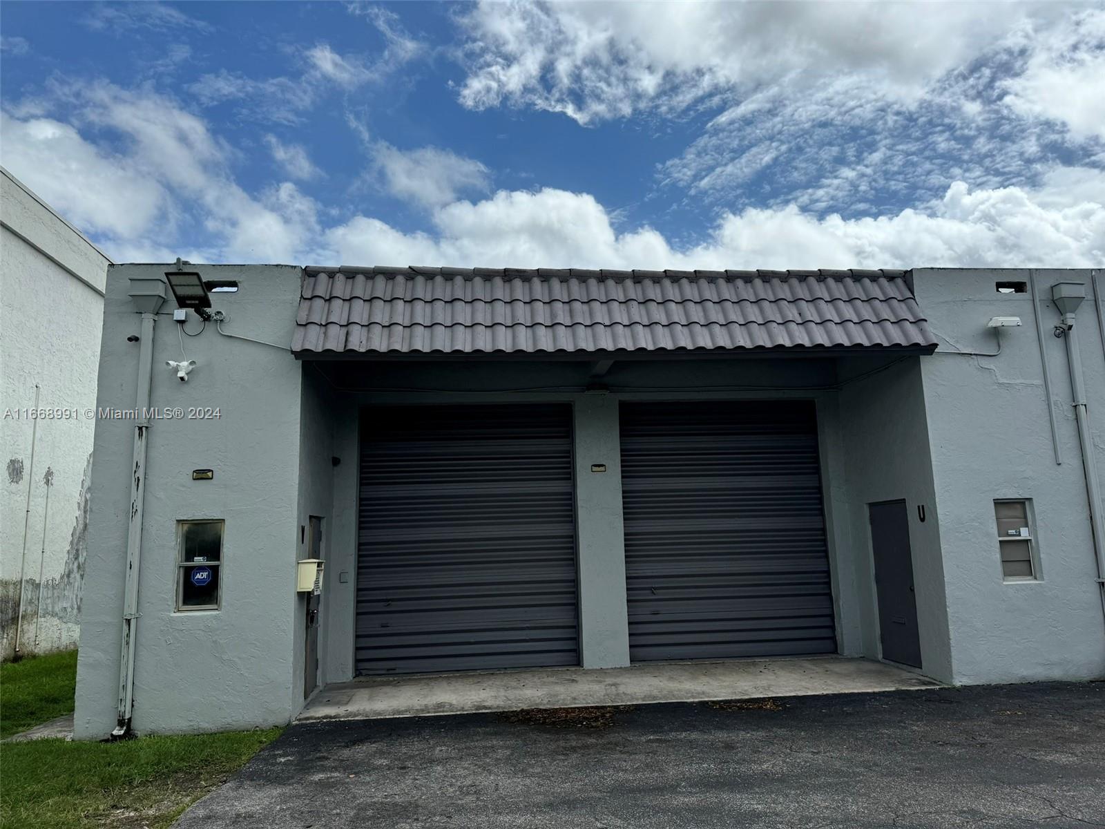Warehouse/Office Combination only rented together. 1,037 sq ft per side for a total of 2,074 sq ft.  The spaces are side by side with 4 parking spaces directly in front of the units.  Office side has a reception area, 2 finished offices, an AC system, a kitchen area, a storage space and a bathroom.  Warehouse side is a large open warehouse with a bathroom, small storage area and a garage door.  Allowable use must be identified and confirmed by prospective Tenant.