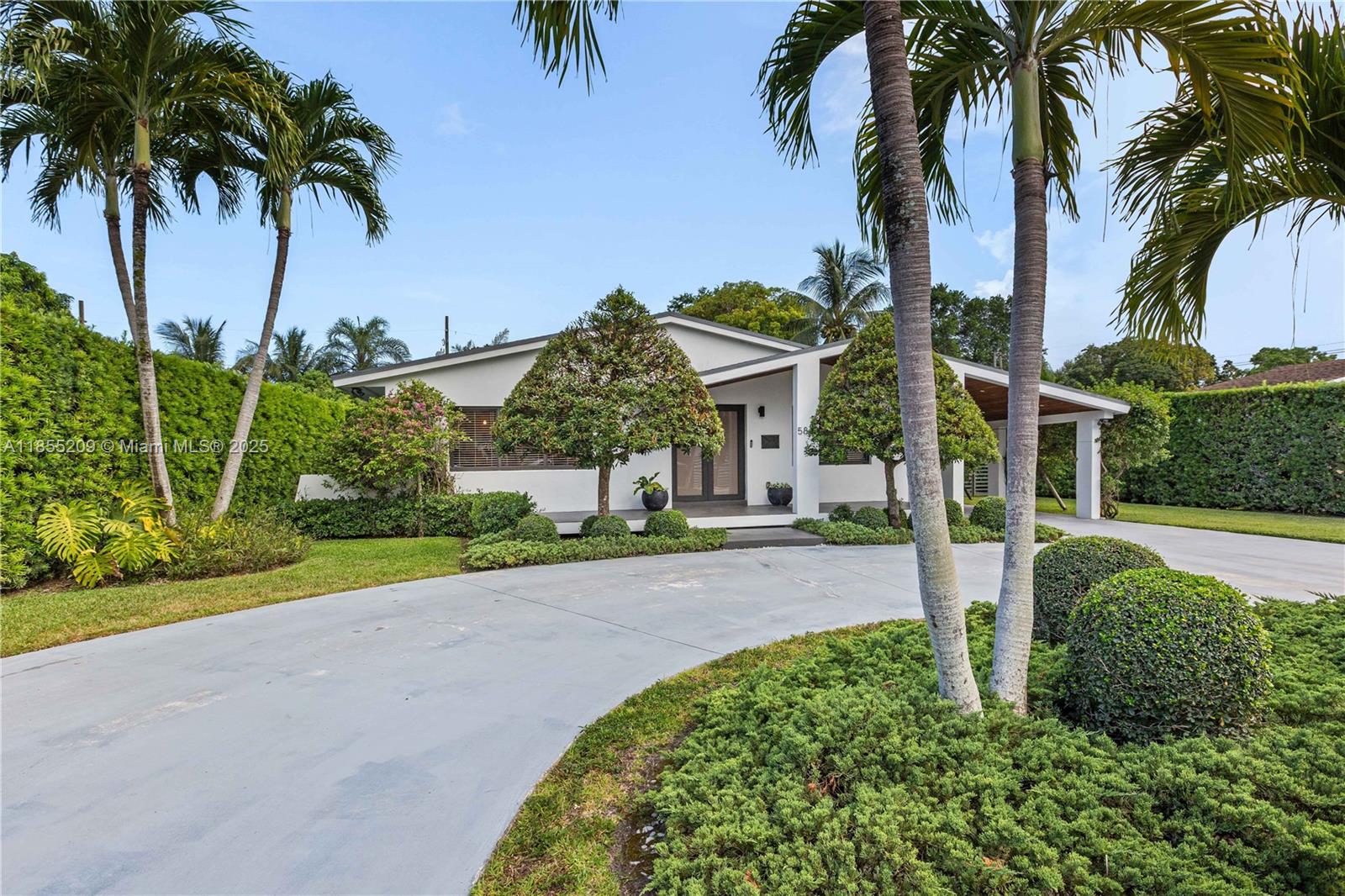 Beautiful, airy, and turn-key! Four-bedroom, two-bath home filled with natural light and offering excellent privacy. This 2,300 sq ft residence is move-in ready, situated on a generous 11,300 sq ft lot with a new saltwater pool and a cabana door. Features include impact windows, porcelain tile floors, a new kitchen with an island, covered patio, and custom built-ins throughout. Additional highlights include a carport, circular driveway, and a new septic tank and drainfield. Located just blocks from Coral Gables and only five minutes from South Miami and the University of Miami.