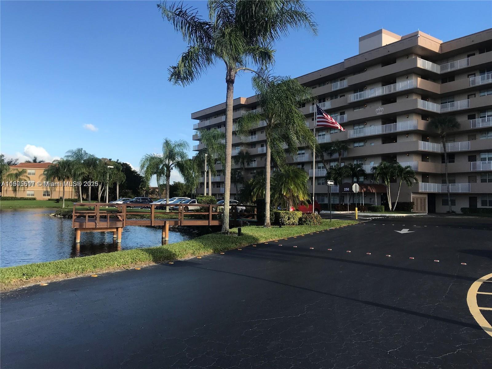 INVESTORS, GREAT OPPORTUNITY. A Fabulous location near shopping centers, banks, restaurants, churches, and both public and private schools. This amazing condominium overlooks the lake and Jacaranda Golf Club, offering a peaceful and scenic setting. Perfect for peaceful mornings or sunset relaxation with a view. Features include hurricane-impact windows, laminate flooring in living, dining areas and bedrooms, and a screened balcony with golf course view. Building has completed all 40-year recertifications, including ceilings, full painting, and plumbing. Secure card access, ample guest and second-vehicle parking. Renting allowed from the first year, and corporations are welcome.