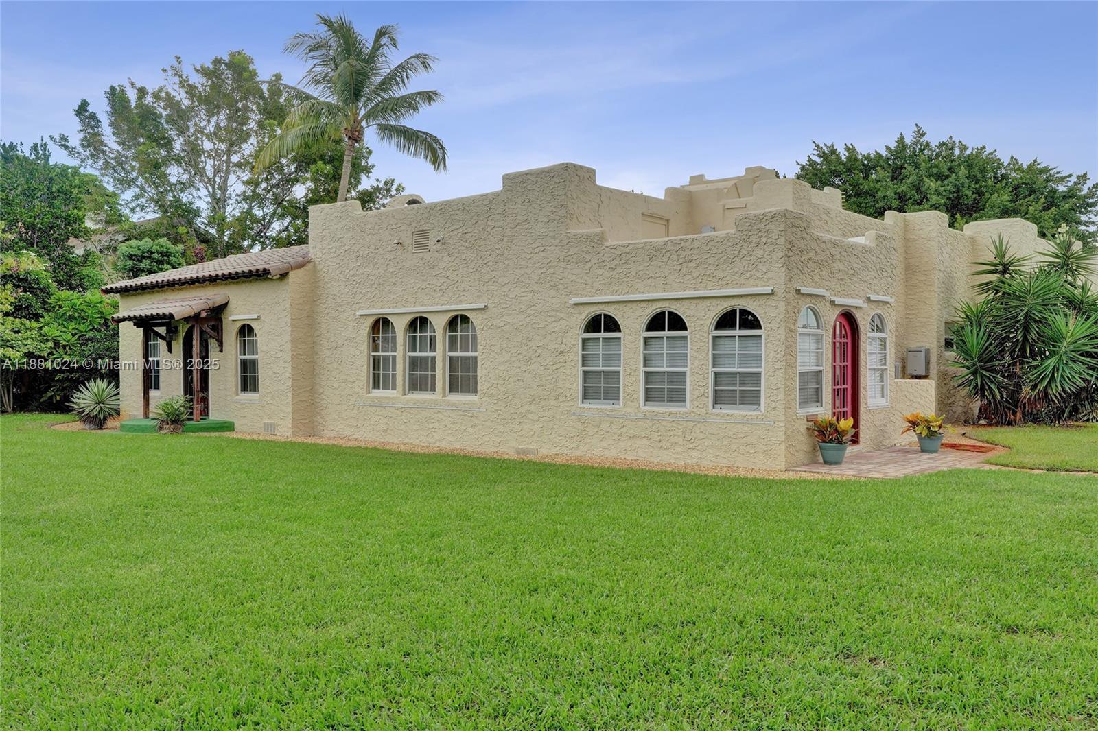 Step into timeless charm with this beautifully maintained 1937 home in East Pompano Beach! Featuring 4 bedrooms and 3 bathrooms, including a detached 1BR/1BA studio apartment—perfect for guests, rental income, or a private office. The main house offers a bright, open layout with original architectural details, hardwood floors, and thoughtfully updated kitchen and baths. Enjoy spacious bedrooms and inviting living areas filled with natural light. The fully fenced backyard provides a lush, private space ideal for entertaining, gardening, or relaxing. Located just minutes from the beach, shopping, dining, and major highways. A rare blend of historic charm, modern comfort, and income potential!
