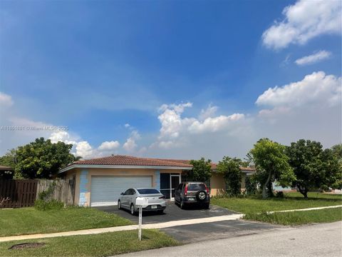 Photo of 8203 NW 73rd Ter, Tamarac, FL 33321 (MLS # A11861881)