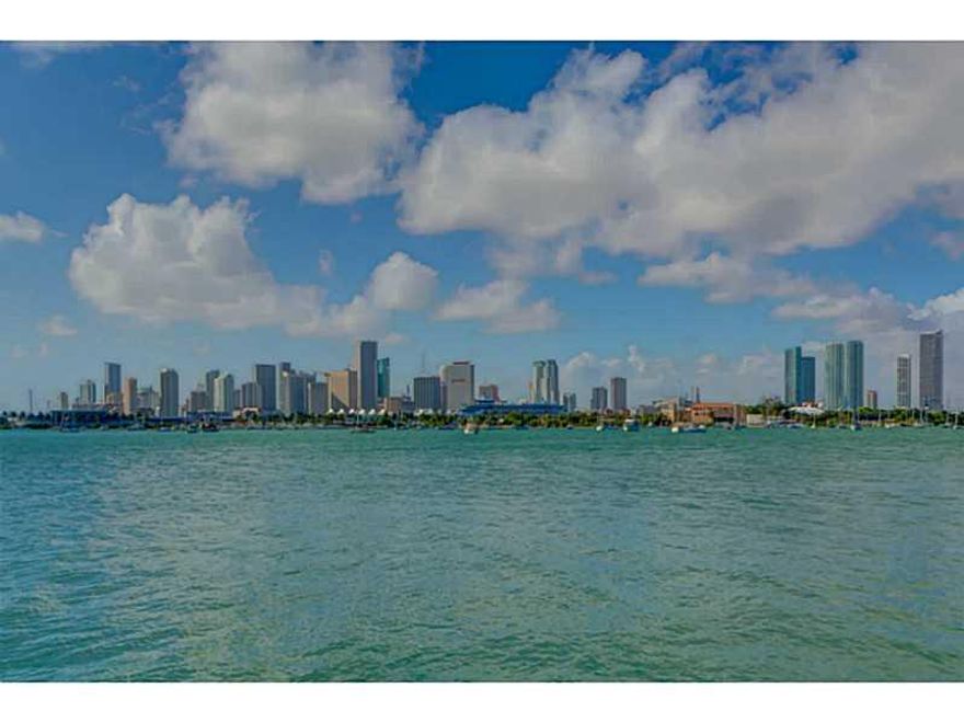 Enjoy one of the most breathtaking panoramas of the downtown Miami skyline and Biscayne Bay from your exceptional 2 story waterfront residence with walls of glass. Steer your large boat to your private 53 foot dock with boat and jet-ski lifts.Property is  nestled in a private, tranquil setting on the remote southwest tip of San Marino Island with 100 feet on the bay, with unobstructed views to enjoy the Miami skyline. Many modern amenities throughout, including a wine cooler with 100 bottle capacity.