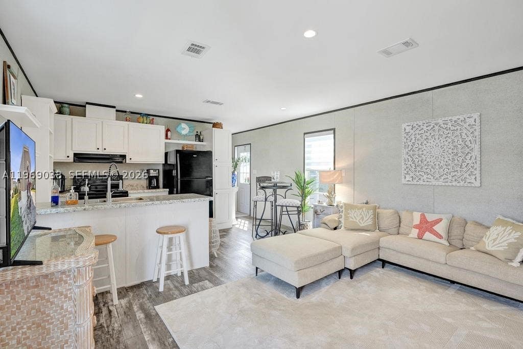 Photo of 315 NE Cardinal Lane Unit Lot L25, Jensen Beach, FL 34957 (MLS # A11969038)
