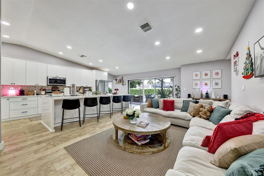 Don’t miss this rare gem! Beautifully updated pool home on a premium oversized corner lot which is much larger than typical neighborhood lots and offers extra privacy, abundant natural light and ample outdoor space.  Step into luxury with a dream gourmet kitchen that has custom shaker-style cabinets with 42” uppers, gleaming quartz countertops, a massive 11’ island featuring extra storage and Moen touch-sensor faucet, 23 cabinets and a huge pantry. Top-tier stainless Samsung appliances include flex-zone refrigerator and air fryer oven. Elegant luxury vinyl plank flooring flows through main living areas along with vaulted ceilings. Modern updated bathrooms, hurricane impact windows, swing doors, and insulated impact garage door add to the updates for peace of mind.  Cool and efficient 2022 Rheem A/C with smart Nest thermostat add to automation and meshes well with complete home smart switches and a three zone sprinkler system with a smart timer with management at your fingertips.  Your private tropical oasis awaits: sparkling refreshing pool with newer Pentair pump, Hayward filter, and captivating color-changing LED lights. Fully PVC-fenced yard with lush privacy hedges.  This is a prime no-HOA location in family-friendly Ramblewood South—close to top-rated schools, parks, shopping, and highways.
So many thoughtful, high-quality updates throughout—you have to see it to believe it! Move-in ready and won’t last long—schedule your showing today!