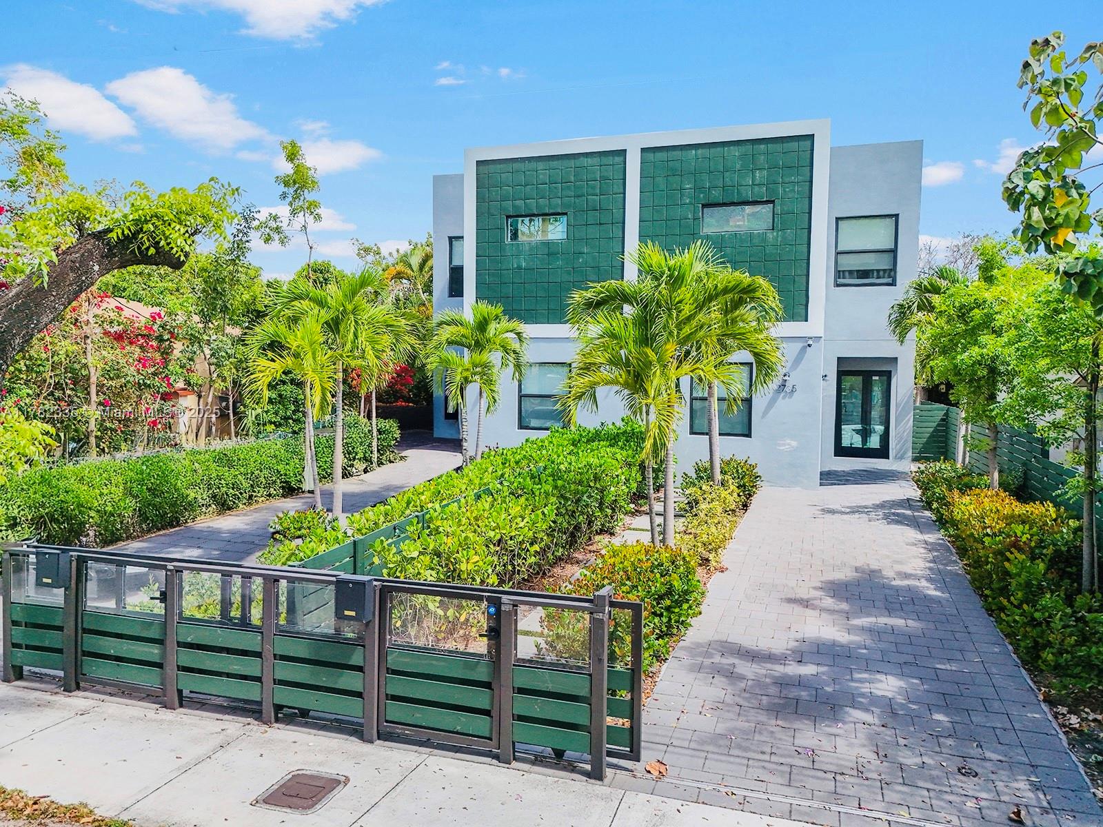 Stunning modern duplex on a tree-lined street, fully fenced with lush landscaping and brick-paved paths leading to private entrances. Numerous impact windows and doors fill the home with natural light, highlighting grey tiled floors and elegant white or beige cabinetry. Spacious bedrooms include a first-floor room ideal for guests or a home office. Enjoy soaring ceilings, an open-concept kitchen, a large pantry, and a laundry room for added comfort. The private backyard offers the perfect space for entertaining, gardening, or quiet relaxation. Located just steps from Calle Ocho and minutes from Miami Int’l Airport, Coral Gables, Brickell, shops, restaurants, hospitals, financial centers, and Miami Dade College (Padron Campus).