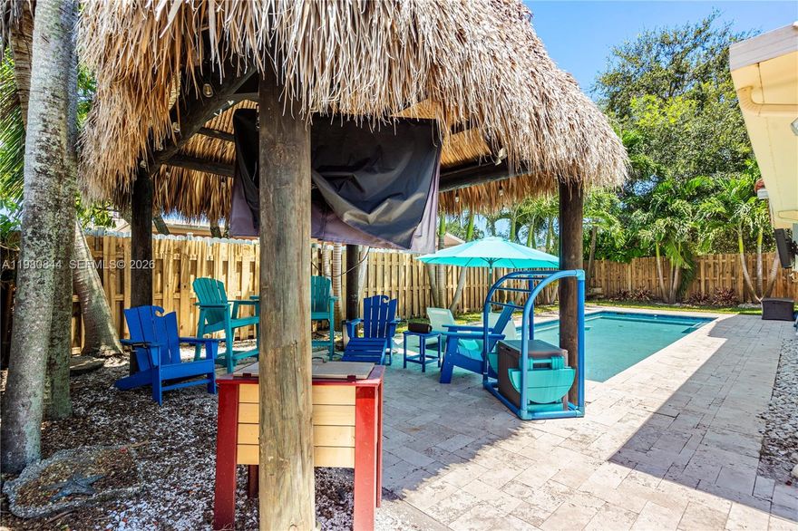 Beautiful and well maintained 4-bedroom 2-Bath pool home with sundeck and tike hut in the desirable Palm Aire West neighborhood. With total square footage over 1,800 including the enclosed and air-conditioned Florida Room, the home is maximized for flexible living. Plantation shutters and lots of light in every room. A spacious and open kitchen with granite countertops, stainless appliances and a dedicated pantry. The garage has been partially converted into a 4th bedroom with its own additional separate outside entrance - perfect for multi-generational homeowners! The modern design pool is heated and has a built-in sundeck lounging area.  There are separate power and cable for outside TVs in the tike hut and alongside of the pool. Ample extra space and storage with a BBQ area and shed on either side of the home.  A mixture of accordion shutters or impact glass throughout ensure storm safety and excellent insurance ratings. Located just north of Cypress Creek Road, Palm Aire is a quiet secluded community with no HOA.  Convenient to both I-95 and the Turnpike without the noise and traffic. Local amenities include nearby grocery stores, shopping and Calvery Chapel. Come see this affordable 4-bedroom option before somebody else scoops it up. Living area square footage is larger than the property tax records indicate.