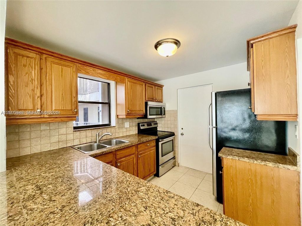 Photo of 2320 S Cypress Bend Dr #204, Pompano Beach, FL 33069 (MLS # A12005948)