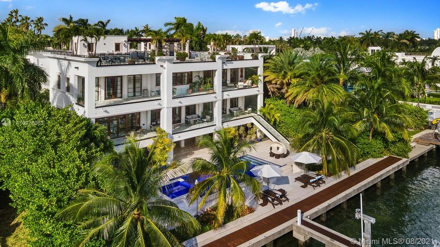 Enjoy Miami’s best views from this distinguished 3-story, waterfront estate on exclusive, guard gated Palm Island. It's 5000+ SF rooftop w/ unique 360-degree visibility boasts unobstructed views of the spectacular city skyline, passing cruise ships & the coveted city sunset views visible not just from its rooftop, but also from its master suite, kitchen, pool deck & many other entertainment areas. Conceived for both indoor & outdoor enjoyment w/ 9 bedrooms/10.5 baths, indoor movie theater, gym, game room, large ground floor entertainment area, smart house systems, & elevator for easy access to all floors. This gated home offers a 4 garages plus space for 6 more cars in the driveway. The home’s private dock can accommodate boats up to 100ft and has a center console lift & a floating dock.