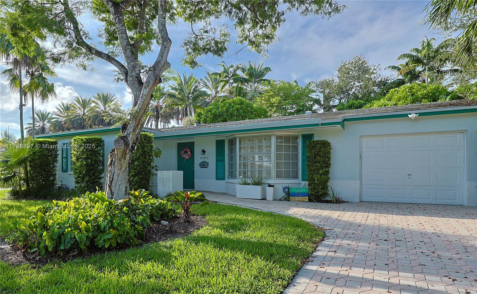 A canopy of mature trees welcomes you to this Charming 3 bedroom, 2 bath home on a quiet Cul-de-Sac located in the sought-after Village of Kendale. A Bay Window accents the large Living Room that connects to the Dining Room. The Updated Kitchen featuring stunning Granite Countertops and Stainless Appliances, opens to an inviting Family Room that affords ample spaces for Entertaining, Eating, and an Office. A highlight of this home is its Lush Backyard! A Trail meanders thru trees around a huge Patio perfect for Gatherings next to the beautiful Reflective Pond. The bedrooms enjoy lots of natural light and the Master has an Ensuite bath with a shower. There is an attached one car garage. Close to Top-Rated Schools, Miami-Dade College, Expressways, Shopping, Dining and Parks.