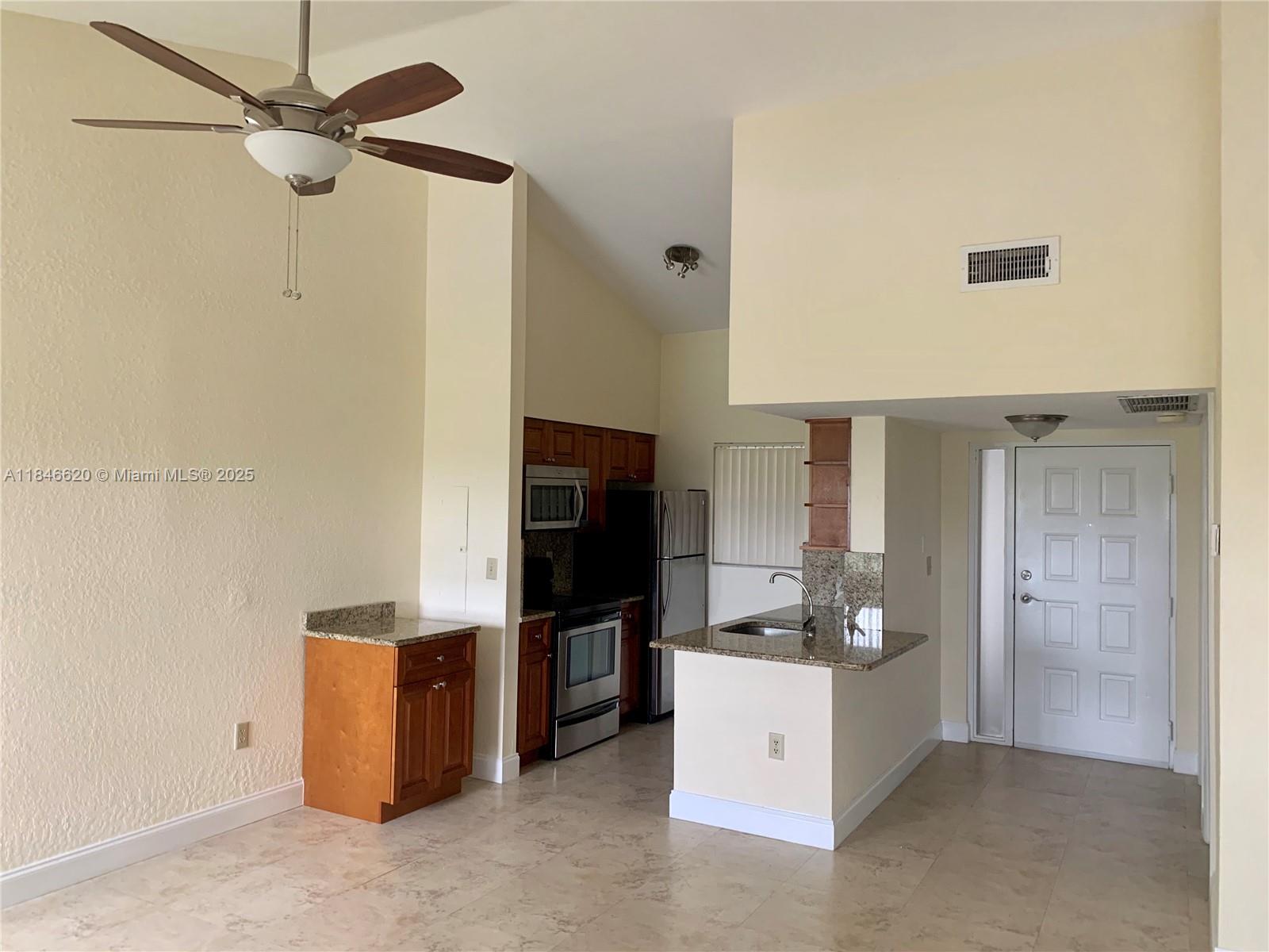 Reduced move-in costs for Excellent Credit. 24-hour approval available. In-unit washer/dryer included. Renovated 2BR/2BA top-floor condo with vaulted ceilings and a tranquil canal view. This upgraded unit features tile flooring throughout (no carpet), modern ceiling fans, and a private screened-in patio. Beautifully maintained community with serene landscaping and convenient access to I-95, Wilton Manors, downtown Fort Lauderdale, and the beach. Pet-friendly. Water, sewer, and trash included in rent. Available August 6.