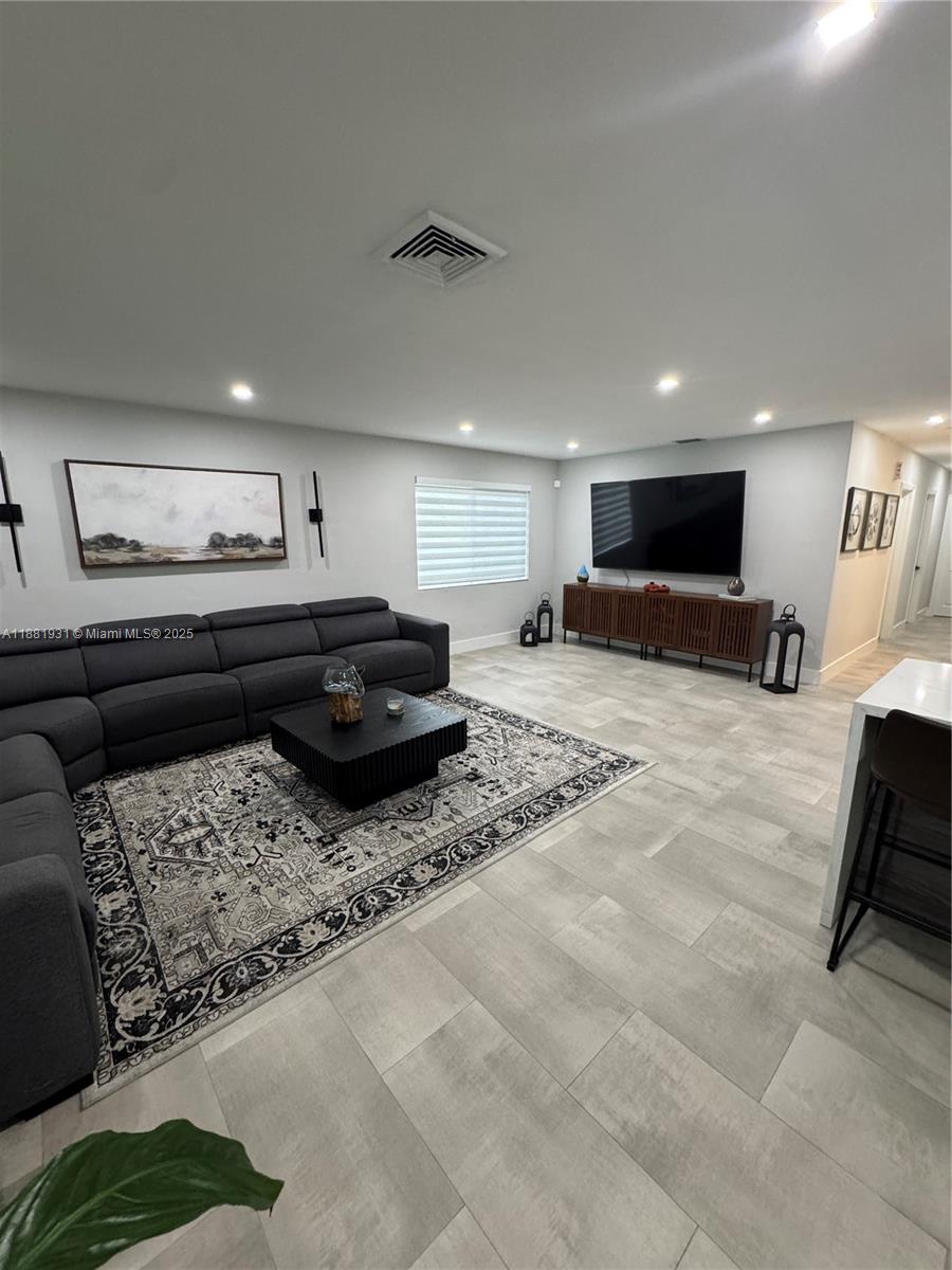 Completely remodeled 5 Bedroom 3 Full bath and In-laws suite. New kitchen, New Flooring, New Bathrooms, 2 car Garage with Newly resurface pool. New A/C with All New Impact Windows and Freshly painted inside. Highly desirable neighborhood. Easy to Show NO HOA