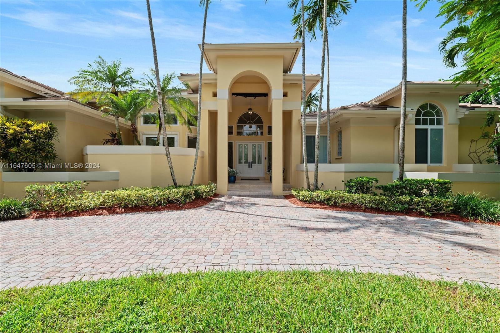 This gated enclave of just 16 homes offers an unparalleled level of tranquility, providing the perfect backdrop for a life of sophistication and privacy. Situated on an expansive lot of over half an acre this home is ideal for a large family. Boasting a formal living rm w soaring ceilings, entertaining space, formal dining rm & open-style kitchen the home design is remarkable. Enjoy a split floor plan; one side 3 beds & 2 ba, and the other w 2 beds & 1 ba, featuring hardwd flrs & renovated baths. Backyard is a paradise with a beautiful pool and ample mango trees. Equipped w impact windows/drs and hurricane screens. Truly a home that has been meticulously maintained and thoughtfully upgraded. This property has been pre-inspected for your peace of mind, and a survey is available upon request