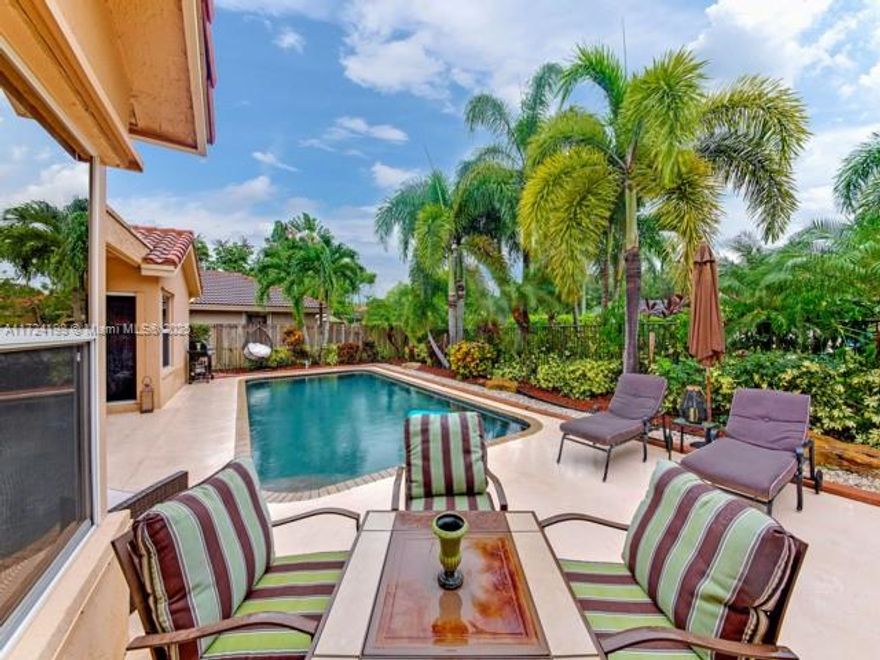 This 4 bedroom + den residence welcomes you, Covered patio, surrounded by the inviting pool, is ideal for outdoor entertaining or just relaxing. Updated kitchen overlooks breakfast nook and spacious family rm. Master suite, complete with spa-inspired bathroom, and den/office are conveniently located on the main level. Stunning tile flooring in living areas, wood flooring in bedrooms. This exclusive gated community offers tennis, pickleball and basketball cts, playground, and picnic area. Zoned for top-notch schools. A Must See!