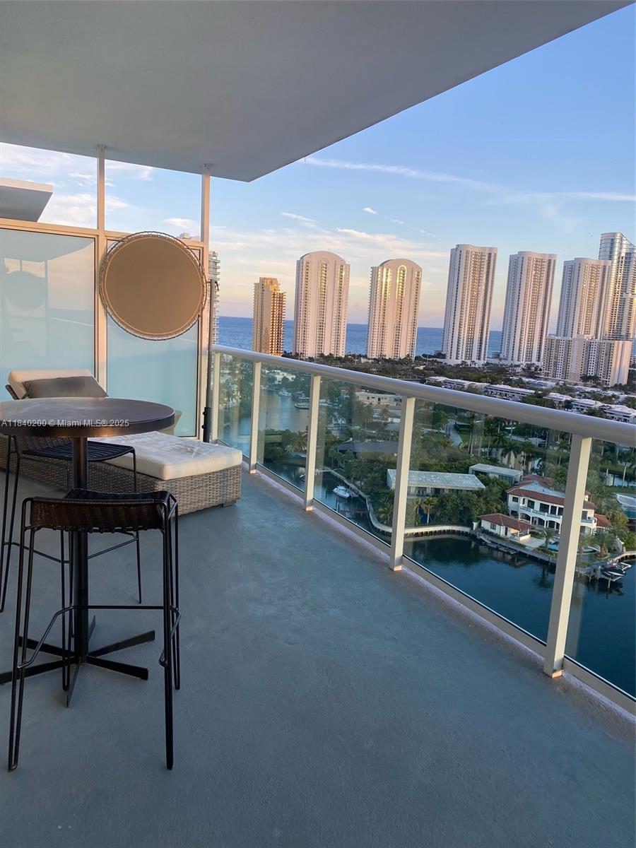 Welcome to your dream home in the heart of Sunny Isles! This stunning 3-bed, 3-bath condo blends luxury, comfort, and natural beauty. Each spacious bedroom includes an ensuite, ensuring privacy for all. The open-concept living area seamlessly connects the kitchen and dining spaces—perfect for entertaining or everyday life. Floor-to-ceiling windows flood the home with natural light and reveal sweeping views of the Atlantic Ocean, Intracoastal Bay, and Oleta State Park. The primary suite offers a spa-inspired bathroom and a generous walk-in closet. Enjoy morning coffee with a sunrise on your private balcony and unwind with sunset views over the bay. Resort-style amenities, plus easy access to beaches, shopping, dining, and top-rated schools, make this a truly exceptional place to call home.