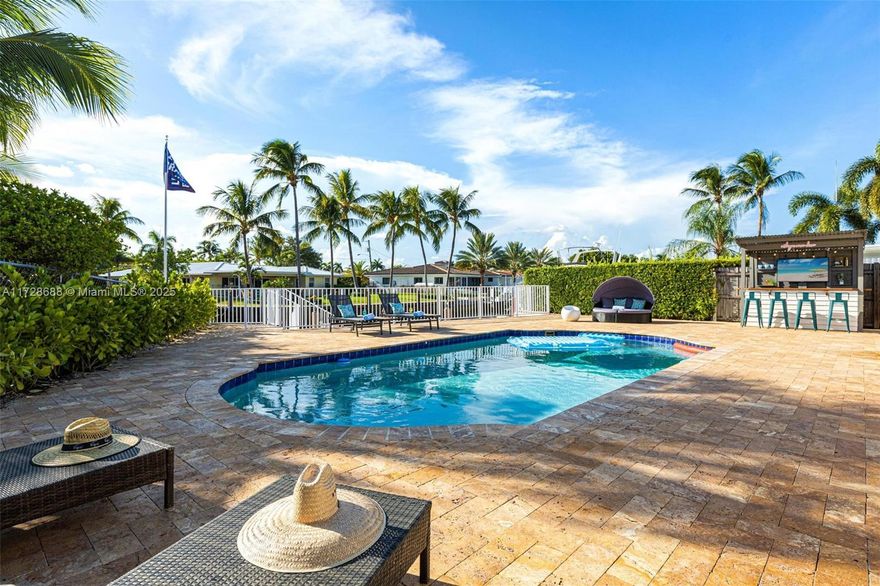 This beautiful 3BR/2BA single-story home offers a pool overlooking the canal, a 35’ dock, and breathtaking sunsets. Enjoy deep water access with no fixed bridges. The spacious heated pool area includes a covered outdoor bar and screened Florida room. Inside, a renovated kitchen and updated baths add modern appeal. The master features a king bed and ensuite shower; a second king bedroom shares a hall bath with a kids’ room with twin trundle beds. Additional features: washer/dryer, storage room, attached garage with automatic door, and new asphalt driveway. Available furnished for annual rental at the listed price (confirm availability with agent); also offered for short-term rental.