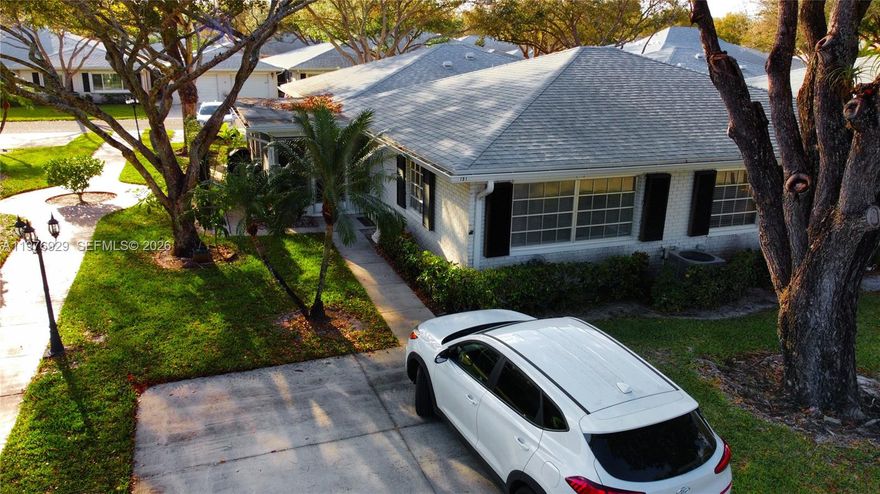 Condo features tile flooring throughout the kitchen, living room, and bathrooms, elegant travertine flooring in the main bathroom, and water-resistant laminate flooring in both bedrooms and the enclosed patio. The updated kitchen offers brand-new stainless steel appliances (including washer and dryer; microwave excluded). The A/C system is a TRANE unit with a newer exterior condenser. Additional upgrades include updated bathrooms with a bubble bathtub in the primary suite, newer roof, newer water heater, fresh interior paint, and popcorn ceilings fully removed for a modern finish.

Enjoy abundant natural light, especially during the morning hours, in the bright living spaces and the plexiglass-enclosed Florida room — perfect for relaxing, reading, or painting. The property includes two assigned parking spaces for added convenience

This villa is a short walking distance to the east pool as well as main pool near clubhouse. One small pet is welcome, making it easy to bring your companion along. Residents of Limetree enjoy true resort-style amenities, including three heated and chilled pools, pickleball courts, bocce ball, and a fitness center.
Minutes from shopping, medical centers, I-95, and the Florida Turnpike, this home offers both tranquility and accessibility 15 minutes driving from the beach.