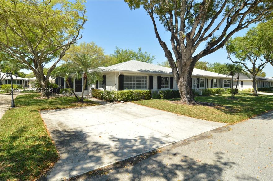 Condo features tile flooring throughout the kitchen, living room, and bathrooms, elegant travertine flooring in the main bathroom, and water-resistant laminate flooring in both bedrooms and the enclosed patio. The updated kitchen offers brand-new stainless steel appliances (including washer and dryer; microwave excluded). The A/C system is a TRANE unit with a newer exterior condenser. Additional upgrades include updated bathrooms with a bubble bathtub in the primary suite, newer roof, newer water heater, fresh interior paint, and popcorn ceilings fully removed for a modern finish.

Enjoy abundant natural light, especially during the morning hours, in the bright living spaces and the plexiglass-enclosed Florida room — perfect for relaxing, reading, or painting. The property includes two assigned parking spaces for added convenience

This villa is a short walking distance to the east pool as well as main pool near clubhouse. One small pet is welcome, making it easy to bring your companion along. Residents of Limetree enjoy true resort-style amenities, including three heated and chilled pools, pickleball courts, bocce ball, and a fitness center.
Minutes from shopping, medical centers, I-95, and the Florida Turnpike, this home offers both tranquility and accessibility 15 minutes driving from the beach.