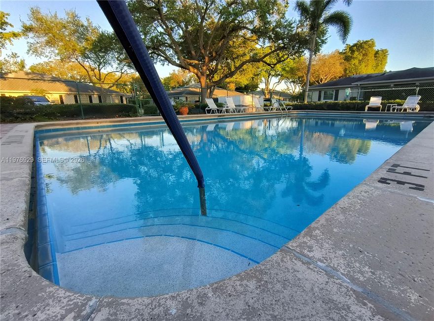 Condo features tile flooring throughout the kitchen, living room, and bathrooms, elegant travertine flooring in the main bathroom, and water-resistant laminate flooring in both bedrooms and the enclosed patio. The updated kitchen offers brand-new stainless steel appliances (including washer and dryer; microwave excluded). The A/C system is a TRANE unit with a newer exterior condenser. Additional upgrades include updated bathrooms with a bubble bathtub in the primary suite, newer roof, newer water heater, fresh interior paint, and popcorn ceilings fully removed for a modern finish.

Enjoy abundant natural light, especially during the morning hours, in the bright living spaces and the plexiglass-enclosed Florida room — perfect for relaxing, reading, or painting. The property includes two assigned parking spaces for added convenience

This villa is a short walking distance to the east pool as well as main pool near clubhouse. One small pet is welcome, making it easy to bring your companion along. Residents of Limetree enjoy true resort-style amenities, including three heated and chilled pools, pickleball courts, bocce ball, and a fitness center.
Minutes from shopping, medical centers, I-95, and the Florida Turnpike, this home offers both tranquility and accessibility 15 minutes driving from the beach.