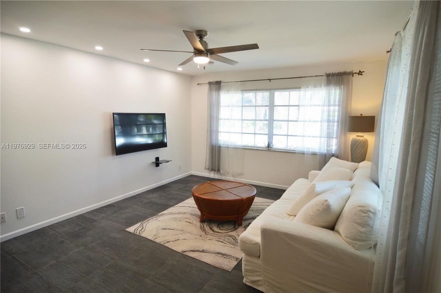 Step into comfortable, low-maintenance Florida living in this well-appointed 2-bedroom, 2-bath villa in a sought-after 55+ pet-friendly community. Quarterly association fees simplify ownership by covering water, sewer, trash, basic cable, exterior maintenance, and roof care.

The community offers a wide range of amenities including a clubhouse with library, fitness center, billiards, shuffleboard, and bocce ball. Residents also enjoy multiple heated and cooled pools, along with tennis and pickleball courts. Conveniently located near shopping, dining, entertainment, major highways, airports, and just a short drive to the beach.

Inside, the home features tile flooring throughout the main living areas, with water-resistant laminate in the bedrooms and enclosed patio. The main bathroom showcases elegant travertine finishes, and both bathrooms have been updated. The kitchen includes updated stainless steel appliances. New washer and dryer in the laundry room.

Additional upgrades include a TRANE A/C system with a newer condenser, newer roof and water heater, fresh interior paint, and smooth ceilings for a modern look. Bright living spaces are filled with natural light, and the enclosed Florida room offers a flexible space for relaxing or hobbies.

The property includes two assigned parking spaces and is within walking distance to both the main clubhouse pool and an additional nearby pool. One small pet is permitted, completing this inviting South Florida home.