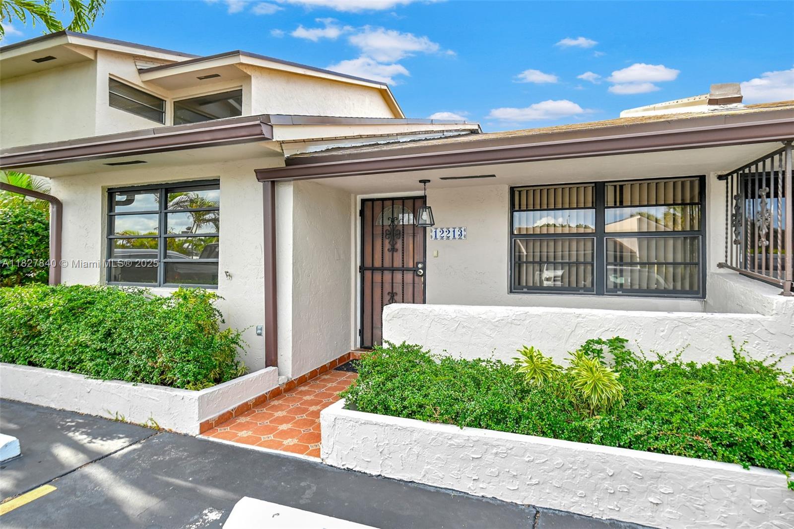 Amazing Location! Rarely available one-story townhome in the quiet and desirable Lake Village community. This charming lakefront home features abundant natural light, a thoughtful layout, and direct lake views from the kitchen, den, and bedroom. In tax rolls as a 3-bedroom, the home is currently configured as 2 bedrooms + a den + 2 bathrooms. Move-in ready, the property has been recently updated and offers: New A/C compressor and handler, New roof, New private deck, Updated bathrooms, Freshly painted interior, Spacious walk-in closets and ample storage. Enjoy the peaceful lake views from your own private deck. 2 parking spaces directly in front of the unit, plus plenty of guest parking.Conveniently located near shopping, FIU, and the Turnpike.Low HOA dues of only $283/month.