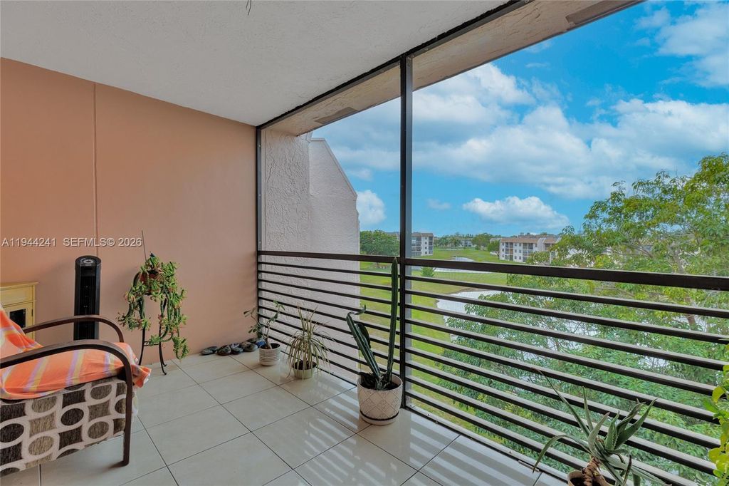 Photo of 2981 N Nob Hill Rd #406, Sunrise, FL 33322 (MLS # A11944241)