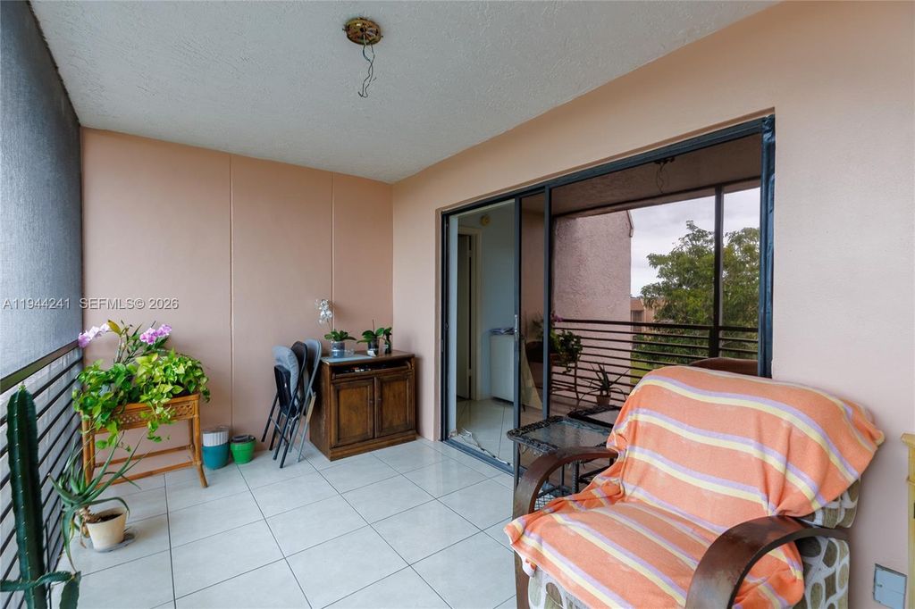 Photo of 2981 N Nob Hill Rd #406, Sunrise, FL 33322 (MLS # A11944241)