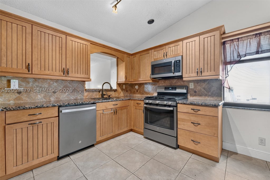 Photo of 7508 SW 6th Ct, North Lauderdale, FL 33068 (MLS # A12059479)