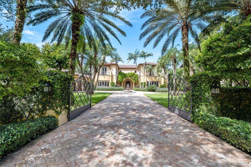 Opulent, Crestron-powered Smart home on gated acre+ lot in Pinecrest. The expansive layout boasts 7 bdrms/ 7.5 baths, grand foyer, stately archways, formal dining rm w/ butler's pantry & custom millwork. Gourmet kitchen w/ 2 islands, Viking & Sub-Zero appliances, built-in coffee maker & large breakfast rm. The regal master suite has adjacent sitting area w/ balcony, & the master spa offers his/her vanities, spa-jet tub & built-in makeup vanity. Impact glass windows frame incredible views of the grounds w/ 2 covered terraces, bullt-in bar, large pool w/ spa & outdoor grill. Added conveniences include 1st & 2nd-floor laundry rms, additional covered drive w/ access to the kitchen & 3-car garage. Be the next to own this unique & private luxury compound w/ the very best in design & technology.