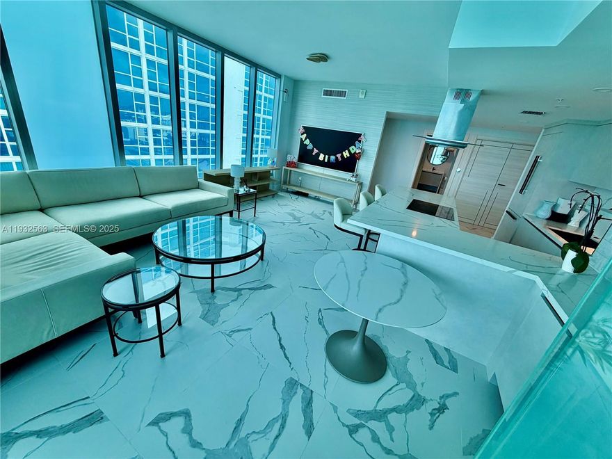 Live the ultimate ocean view lifestyle in this impeccably renovated 2 bedroom, 2 bath corner residence at the prestigious Carillon Miami Wellness Resort North Tower. Completed in 2024, this stunning home features a full, no-expense-spared renovation blending modern luxury with serene coastal living.

Floor to ceiling custom windows, with electric blackout at the touch of a button, fill the home with natural light and frame breathtaking Atlantic sunrises. Step onto your private oceanfront terrace to enjoy morning coffee with the sound of the waves or relax as the sky transforms at dusk. Sleek tile flooring flows throughout the interior and balcony, enhancing the clean, contemporary design.

The open-concept chef’s kitchen impresses with top-of-the-line appliances, custom lighting, and bespoke cabinetry. Refined finishes continue throughout. The primary suite boasts a truly astonishing direct ocean view, with the tenth floor location offering engagement with the beach, making every morning feel like living in a retreat.

Residents enjoy five-star resort living with access to Carillon’s award-winning 70,000 square foot spa and fitness center, four oceanfront pools, private beach service, valet, concierge, 24-hour security, dining and lounge options, and 100+ weekly wellness classes.

Ideally located near Bal Harbour Shops, dining, cafés, groceries, and the Miami Beach boardwalk, this residence offers luxury, wellness, and convenience in one exceptional oceanfront home.