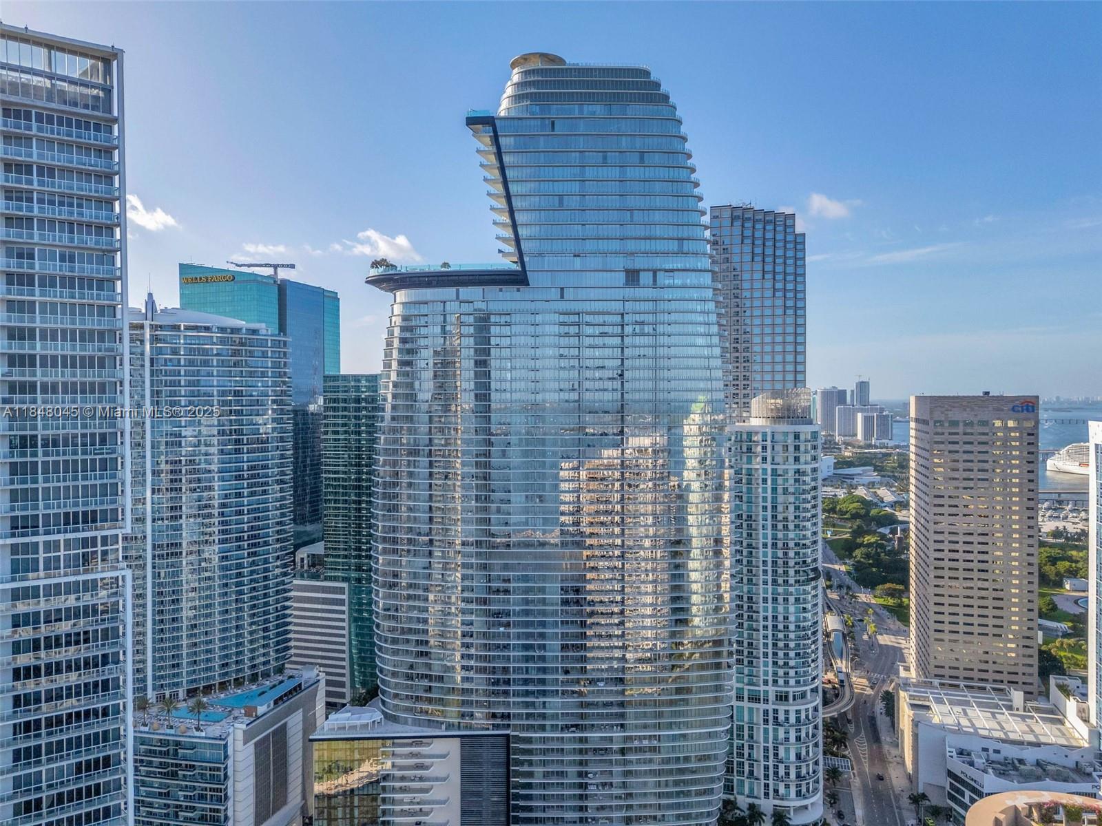 Available immediately in the prestigious Aston Martin Residences, this brand-new, never-lived-in 4-bedroom, 6-bathroom waterfront residence offers approximately 3,536 sq ft of elegant living space framed by soaring floor-to-ceiling windows and 10-foot ceilings. The thoughtfully designed split-bedroom floorplan includes separate staff quarters and a laundry room, complemented by exquisite finishes such as marble and ceramic tile floors, an open kitchen with island, formal dining room, entrance foyer, family room, wet bar, solar-tinted glass, and European cabinetry throughout. Expansive views of the Intracoastal, Miami River, and Biscayne Bay can be enjoyed from multiple vantage points, including a large open balcony ideal for relaxing or entertaining against a stunning waterfront backdrop.