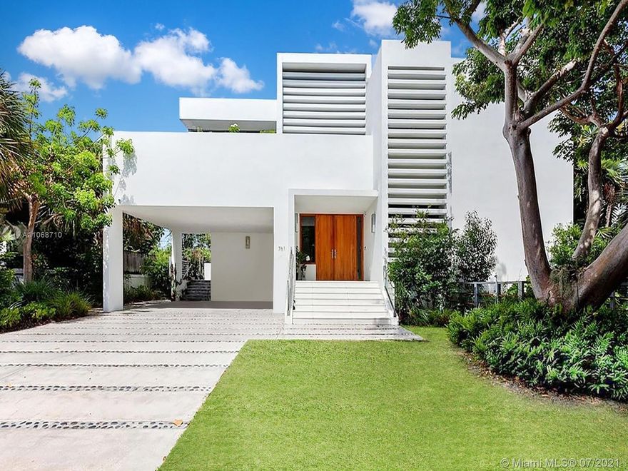 It’s easy to fall in love with this modern luxury home in its tropical island setting! An inviting grand entrance opens to the living and dining room with views of the pool & fountain. The glass door panels are fully stackable creating a seamless indoor / outdoor living experience - enhancing the entertaining space without compromising inside comfort. The kitchen is state of the art with Wolf / Sub-Zero appliances. A chic rooftop terrace with a summer kitchen and vertical garden is perfect for sunset happy hours. The five bedroom home has recently been upgraded throughout including brand new Porcelanosa bathrooms throughout, new integrated lighting, pool deck, lush landscaping & more.