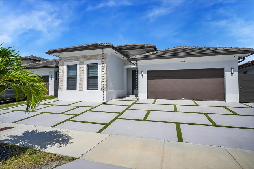 Stunning 2023-built single-family home featuring modern open-concept living with high ceilings, abundant natural light throughout.  This beautifully maintained home offers spacious living areas, oversized kitchen island with seating, impact windows and doors, tile flooring throughout, and a resort-style backyard complete with heated and chilled pool, jacuzzi spa, and covered terrace perfect for year-round entertaining. Property also features an attached private 1-bed, 1-bath in-law quarters with separate entrance, ideal for extended family, guests, home office, or flexible living arrangements.  Modern driveway design, excellent curb appeal, and move-in ready condition.  Conveniently located near major highways, shopping, dining, and schools. No HOA!
