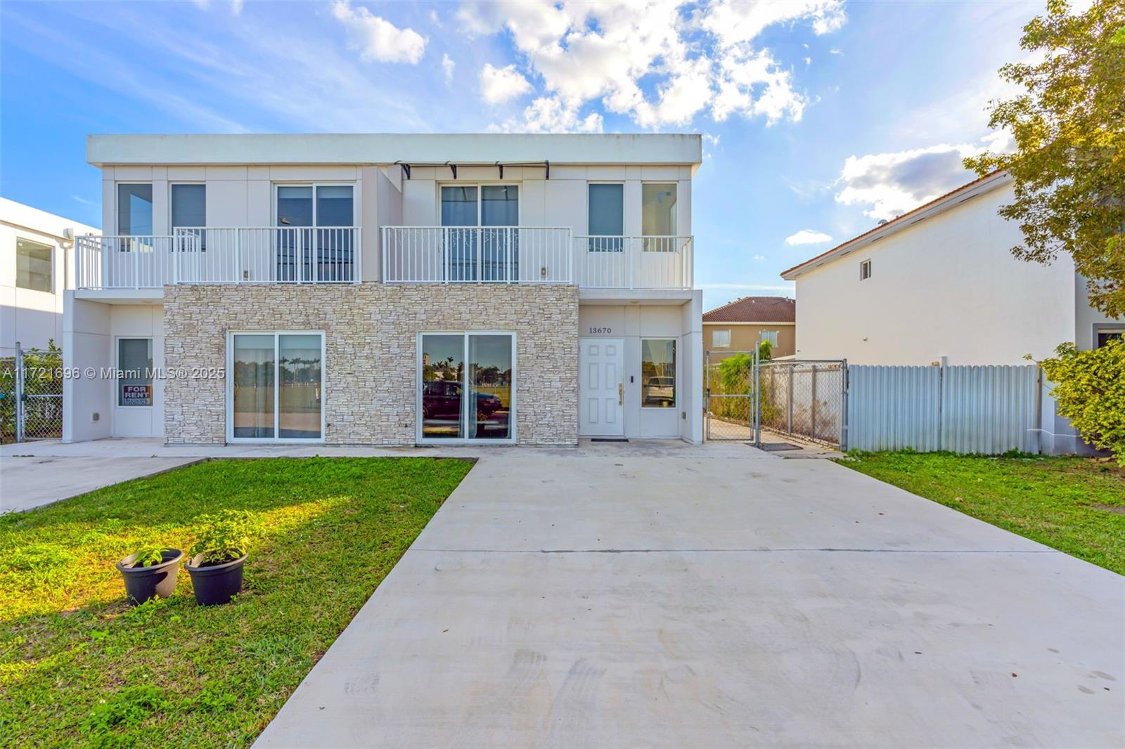 This home is upgraded and move-in ready, featuring 4 bedrooms, 3.5 baths, and high-impact windows and doors. The fenced backyard and long driveway offer space for cars, a boat, or an RV, with no HOA. Spacious kitchen with quartz countertops, and stainless steel appliances. Bedroom with en-suite bathroom and walk in closet on first floor.
The primary suite boasts a private balcony, walk-in closet, and luxurious bathroom. Conveniently located near the Turnpike and US-1. NO HOA!