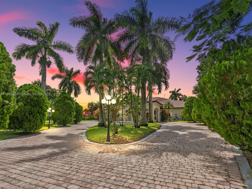 Elegance meets functionality in this 4BR/4.5BA custom gated oasis in the Redlands. This meticulously crafted residence boasts 4,752 SqFt of luxury living space on an expansive 5-acre lot (221,633 SqFt). Also available for sale with lot to the North, totaling 10 Acres (445,313 SqFt) for $3.225M. Feat. a 3-car garage, covered car porch with circular driveway, an inviting pool oasis with jacuzzi, complemented by a screened outdoor terrace feat. wood ceilings & cooling fans. Crafted like a fortress, the house has solid poured concrete walls, impact windows/doors, a 4-foot concrete foundation & gas generator. Energy efficiency is guaranteed by premium insulation throughout. Revel in the landscaped grounds with sprinkler system, water well, & mature fruit trees. Your dream sanctuary awaits!