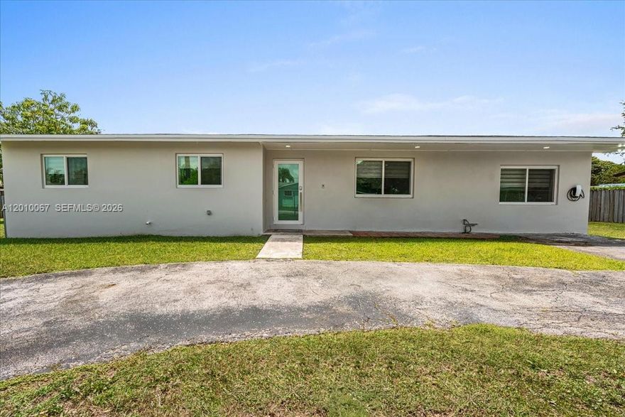 Beautifully reimagined 4BR/3BA home, fully remodeled with a converted garage creating a spacious second primary suite—ideal for guests or multi-generational living. Enjoy laminate flooring throughout, impact windows and doors, recessed lighting, and a bright, open layout with an oversized family room perfect for entertaining.

The kitchen shines with stainless steel appliances, a farmhouse sink, elegant quartz countertops, and a Frigidaire microwave with built-in air fryer. All three bathrooms offer spa-like finishes with rain shower heads. Additional upgrades include a tankless water heater, commercial-grade Speed Queen washer/dryer, and custom closets for optimal storage.

Situated on an oversized lot with plenty of room for an RV, boat, and even a future pool. Ideally located just two blocks from South Dade Park and close to shopping, dining, and major highways—this move-in-ready home truly feels like new! No HOA. No CDD.