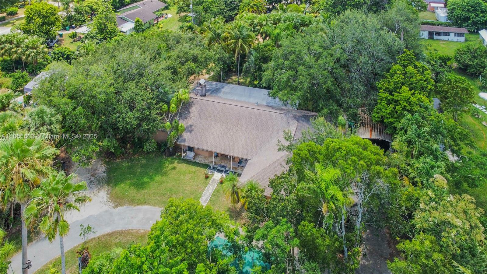 NO HOA! This is the Redland ya'll! Sought-after area but still close to it all, (just off 296 (Avocado) but off a very inconspicuous side road. This may be a handyman special in some ways but the roof is only 6 years old. You are being offered the rare chance to craft your dream estate in The Redland. Featuring 4B/2B w/ 2 car garage, this gem has LARGE living area (2921 FT -w/a total area of 4459 SF! The boathouse can be used as it's namesake or for your toys, equip, work trucks- & it's out of sight from the road. Nestled on a generous oversized acre lot (50,094 SF), this home is brimming w/potential for the visionary buyer. Whether you’re looking to restore its charm or modernize it entirely, the possibilities here are endless. RV parking. Equipment parking. Room for a pool. Good bones!