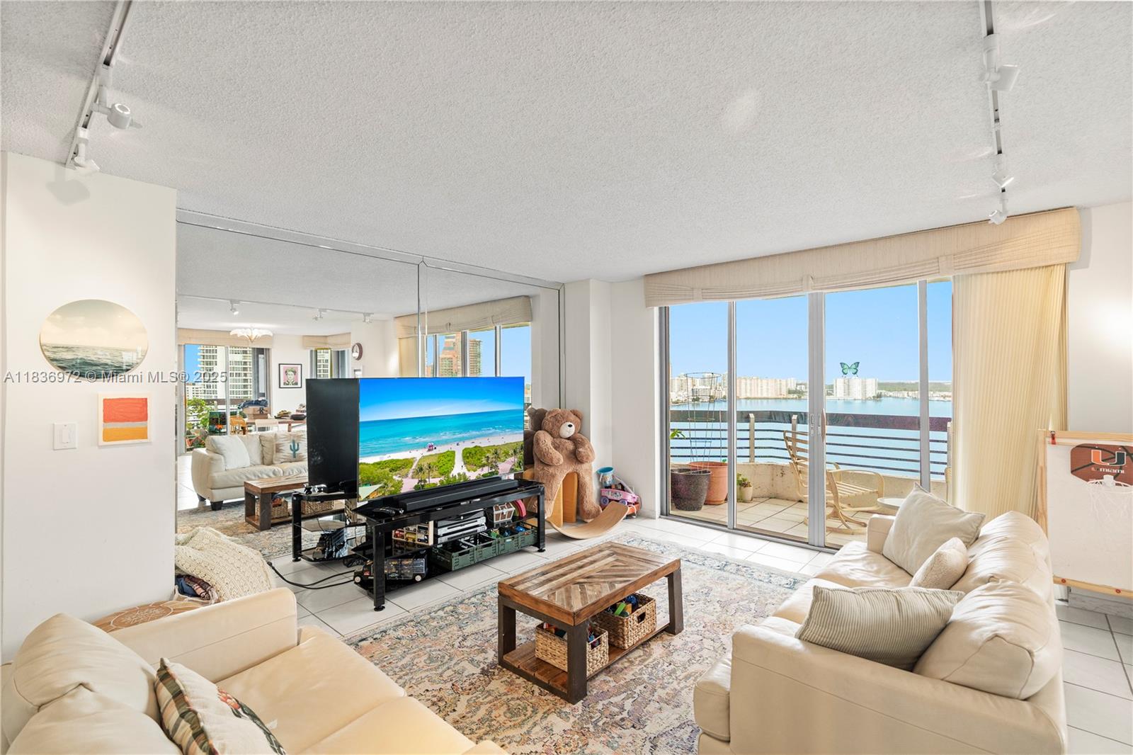 Discover this private corner unit with a desirable two-bedroom, two-bathroom layout, offering wide-open Intracoastal views. Enjoy indoor-outdoor living from the expansive wrap-around balcony, protected with hurricane shutters and surrounded by floor-to-ceiling windows. Ceramic tile flooring runs throughout. Private washer and dryer. Resort-style amenities include a restaurant, tennis, basketball and pickleball courts, sauna, lush-landscaped gardens, 24/7 security, a coffee shop, a mini market, fitness center, outstanding pool overlooking the water. Ideally located near the Aventura Mall, the beach, Sunny Isles, and houses of worship. A rare opportunity for comfort, convenience, and luxury in one of Aventura’s most sought-after communities. Rented month to month.