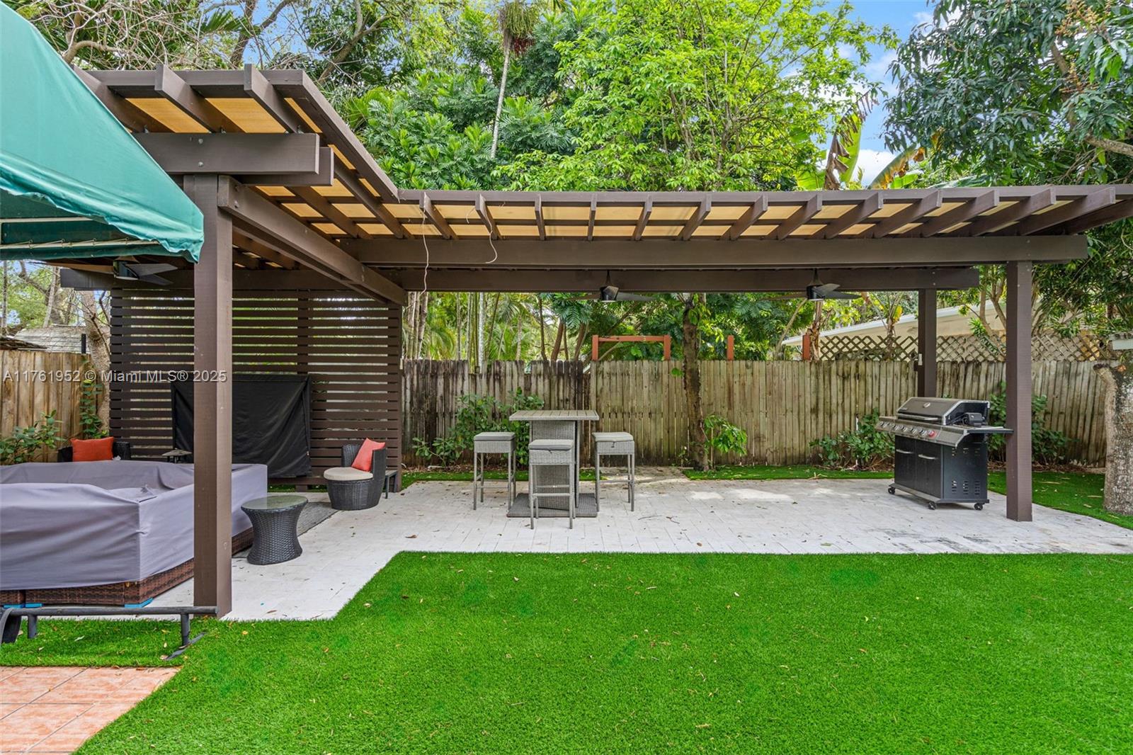Sought after beautiful South Miami 3/2 home with a 1/1 cottage, beautifully remodeled home features a modern, open floor plan with a european inspired modern kitchen remodeled in 2021, stainless steel countertops, impact windows & doors, newer roof, updated bathrooms, plantation shutters, and wood like tile flooring. Enjoy a 125’ deep lot with a spacious pergola built for entertaining, a mature mango & avocado trees, and a fenced, gated entrance. Close to Ludlum Elementary (A-rated) and key Miami hubs!