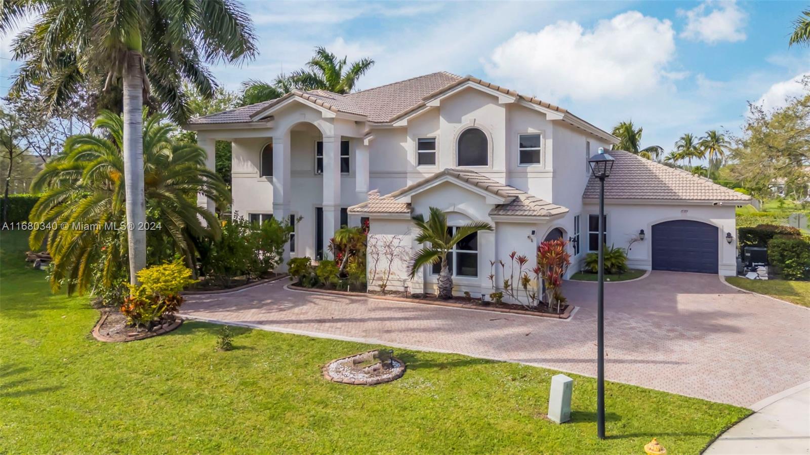 Luxury meets comfort with this beautiful property located in the heart of Davie in one of the most exclusive guard gated communities. Being the largest model in all of Riverstone, this home is situated on a corner lot on a culdesac offering the utmost privacy with only one other home in the entire community like this one. This smart home boasts of 5 spacious bedrooms, an office + loft & 4.5 baths, two of which are ideally located on the main floor. Outdoor living space galore!! Huge balcony overlooking the gorgeously remodeled back yard with a brand new pool and all new marble deck. ALL NEW IMPACT WINDOWS AND DOORS!!