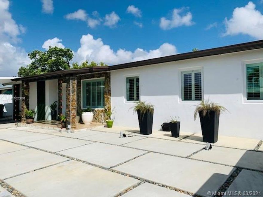 Beautiful House, fully remodeled, Move-In Ready, Main House 3/2 plus 1/1 efficiency (Legal with permit) rented extra income or could be extra bedrooms for a big family, Impact Window and Doors, gated front entrance.