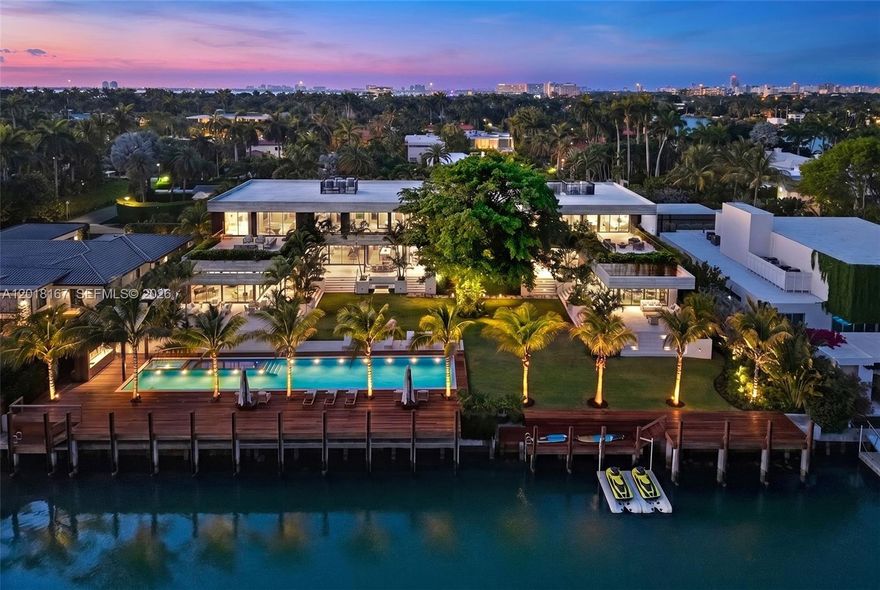 Introducing Sunset Estates, a once-in-a-generation opportunity to own one of Miami Beach’s most significant architectural waterfront compounds. Located within the exclusive guard-gated Sunset Islands III, steps from Sunset Harbour, this extraordinary waterfront compound spans over 32,000 SF of prime land with 187 feet of combined water frontage. Designed by renowned architect Kobi Karp and developed by Todd Michael Glaser, the property was envisioned as a primary waterfront residence complemented by an elegant detached guest residence, creating a one-of-one modern tropical compound. Surrounded by landscaped grounds, an Olympic-length lap pool, spa, and expansive terraces, both homes showcase matching contemporary architecture defined by Brazilian Ipe wood, exposed concrete, soaring 12-foot ceilings, elevated finishes, and seamless indoor-outdoor living. The primary residence features 6 bedrooms, 6 bathrooms, private office, powder room, cabana bath, bar, family room, smart home system, elevator, and a gated covered motor court for 10+ cars. The primary suite includes dual dressing rooms, spa-style bath, and private terrace with outdoor shower. Completed in 2025, the guest residence features 2 bedrooms, 2.5 bathrooms, full kitchen, waterfront gym, conference lounge, laundry room, and private double-height garage. A trophy waterfront estate delivering a level of scale, architecture, privacy, and lifestyle nearly impossible to replicate within Miami Beach's most coveted enclaves