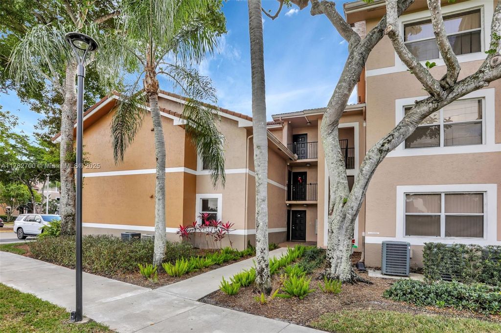 Photo of 8891 Wiles Rd #102, Coral Springs, FL 33067 (MLS # A11782700)