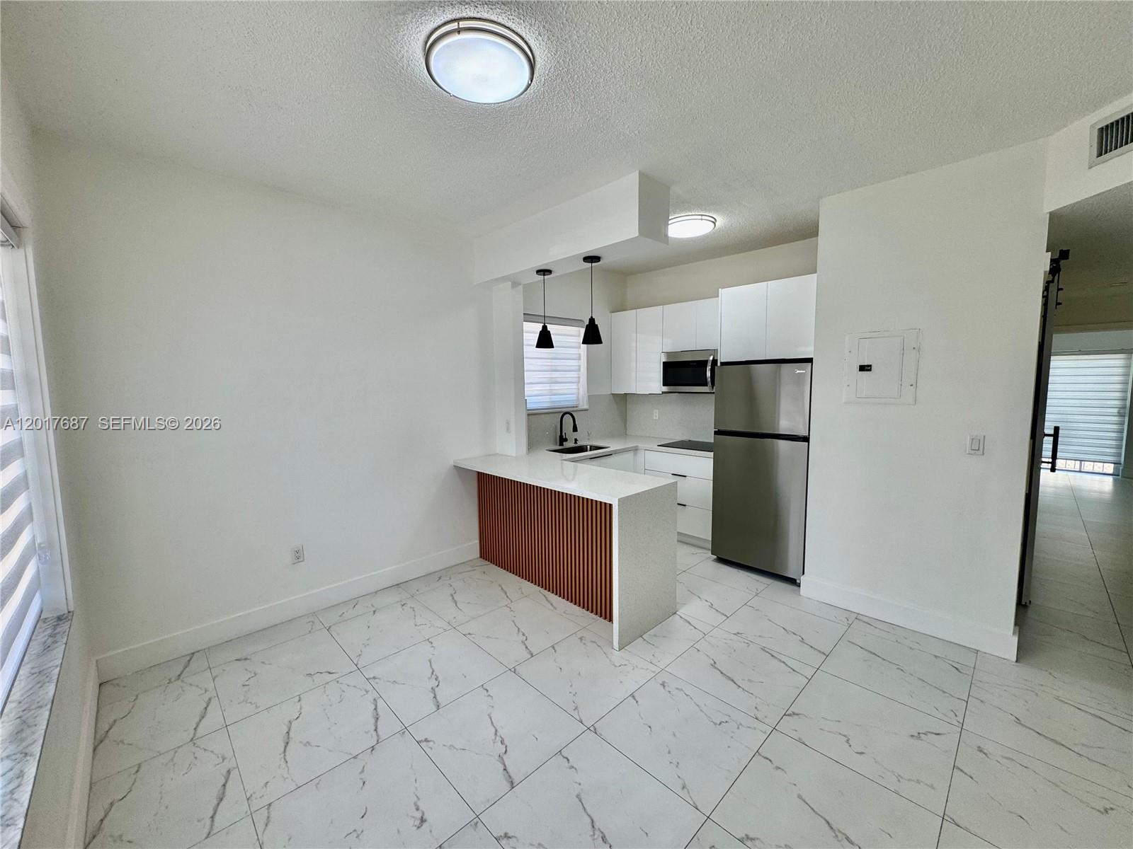 View photos, virtual tours, details... 421 NW 13th Ave A