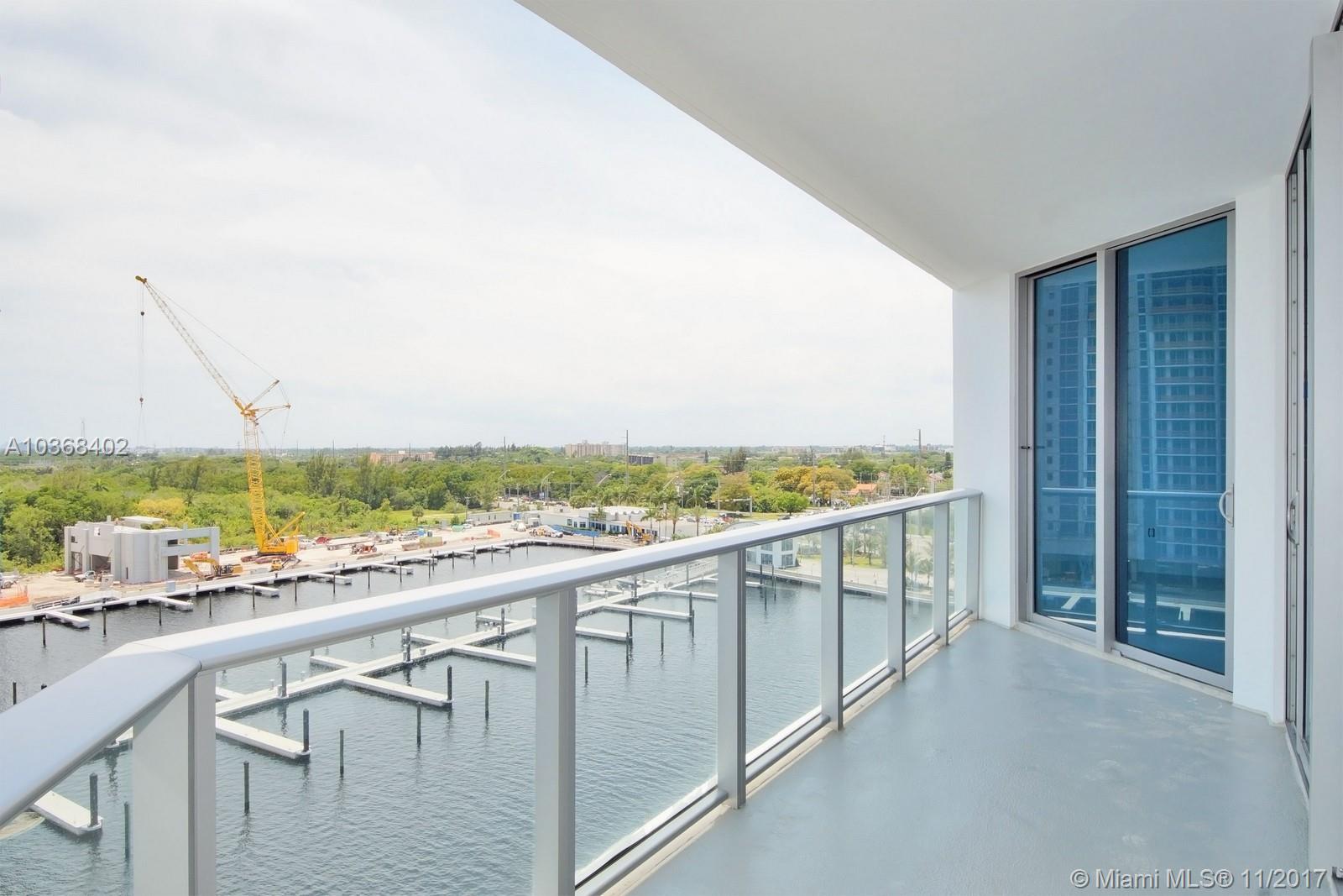 Spacious 1873 square foot unit and 198 square foot terrace with 50 foot boat lift and premium finishes. Marina Palms residences offers an interior elegance, views facing South. Porcelain floors through with custom made walk-in closets, Snaidero cabinetry, stone counter tops; Wolf, Miele, and Sub-zero appliances, 2 parking spaces and valet. Concierge, club room, children's room, fitness center, complete with spa facilities, pool overlooking the bay, and full service marina.