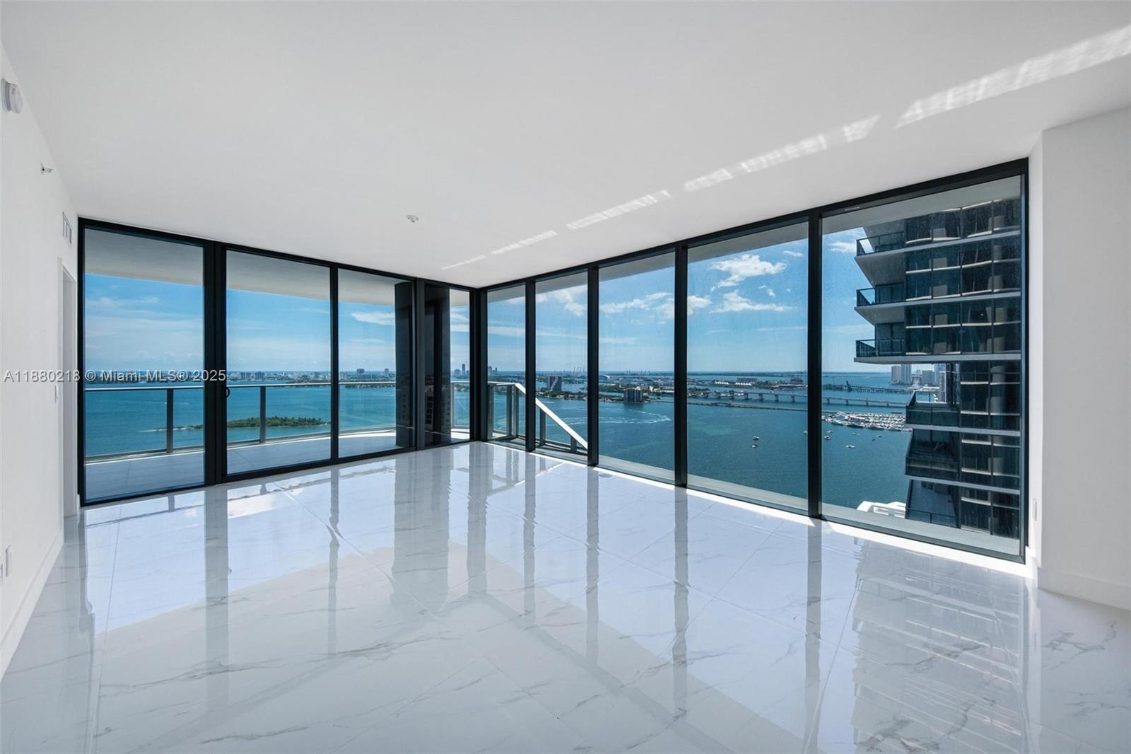 Stunning corner with views of the bay, ocean and skyline unit Elevated on the 31st floor of Aria Reserve’s s a flow-through 4-bed, 5.5-bath plus de easily convertible to a 5th bedroom, 2,555 sq ft of interiors and 297 sq ft of bayfront terraces. A private elevator opens to soaring 10-foot ceilings, a luminous great room, and a chef’s kitchen with Italian cabinetry,stone counters A full maid’s quarter enhances flexibility for service or guests. Walls of glass frame sweeping views from sunrise over Biscayne Bay to sunset over the city. Residents enjoy curated amenities: two acres of waterfront w. semi-Olympic pool, spa, fitness center, basketball and tennis, marina, coworking lounge, and children’s playrooms. Positioned in Edgewater, steps from Wynwood and the Design District best spots