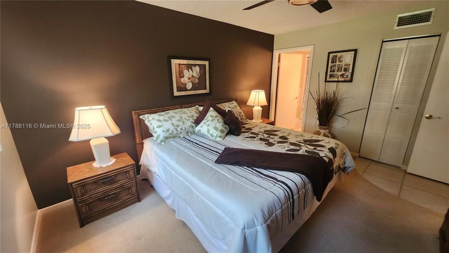 This 1 bedroom, 1.5 bathroom condo is perfect for families and pet owners. The spacious balcony offers a serene garden view, ideal for relaxation. In-unit laundry facilities with washer and dryer make household chores easy. The property features a 5-year-old AC system, updated bathroom, and new countertops. Impact windows provide added security and energy efficiency
The community's clubhouse offers various amenities, including a pool, lighted tennis courts, exercise room, billiard room, card room, and library. Large dogs are allowed, making it ideal for pet owners. With its family-friendly atmosphere and pet-friendly policy, this condo community is perfect for those seeking a relaxed lifestyle.