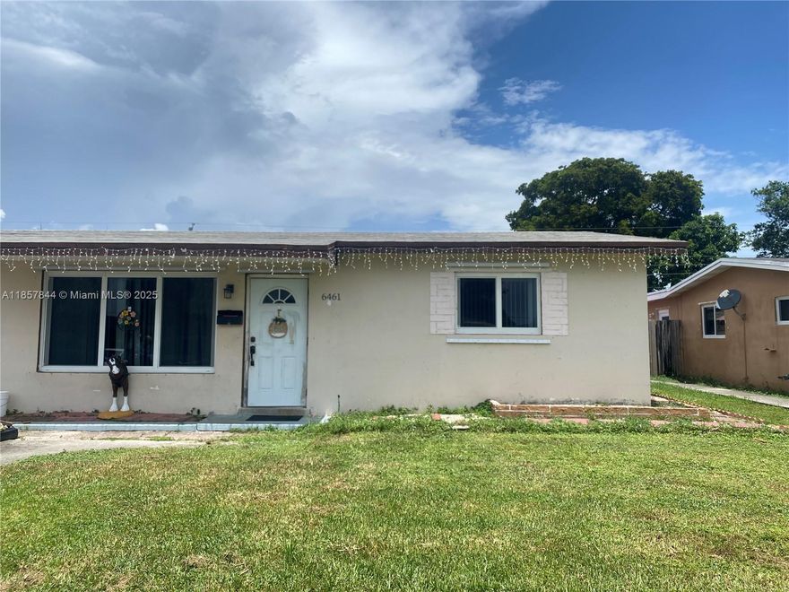 Investors Dream! Spacious home located on a lovely street in Hollywood.  Centrally located!  Porcelain floors, spacious backyard, and a lovely kitchen.  Impact windows and/or shutters.  As per owner:  appliances, water heater, refrigerator were replaced.