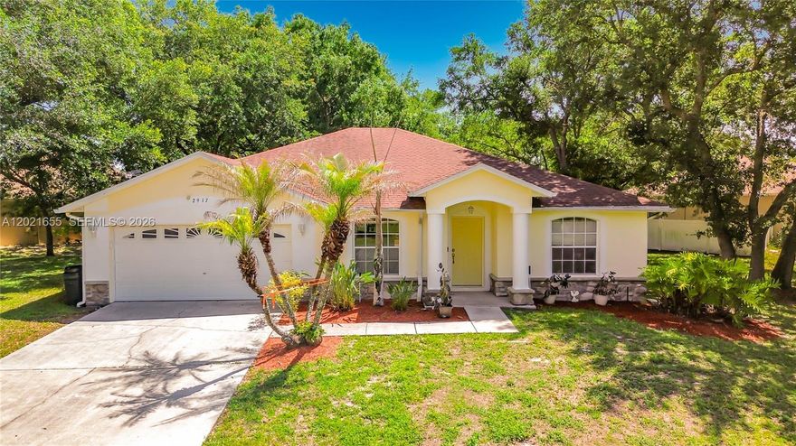 Welcome to 2917 Evans Way in Doral Woods! This beautiful 3BD/2BTH home with a Flex Room that can easily serve as a 4th bedroom or home office also features a 2 car garage and sits on one of the largest lots in the neighborhood at .42 acres. With plenty of room to expand or build a pool, the possibilities are endless. Located in a quiet community, this well-maintained, move in ready home features a roof replaced in 2018, A/C and Condenser approximately 2 years old, and a septic system professionally drained and serviced in 2026. Interior updates include new Corian kitchen countertops, a new sink, gas range, and newly installed wood look tile flooring throughout the main living areas, with carpet in the bedrooms for added comfort.  The guest bathroom offers convenient direct access to the covered patio, making it ideal for future pool plans. Enjoy relaxing outdoors under the covered patio surrounded by lush trees and greenery, creating a peaceful and private retreat. Best of all, there's no HOA approval required & no CDD fees.