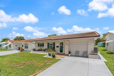 Photo of 5713 NW 87th Ave, Tamarac, FL 33321 (MLS # A12063013)